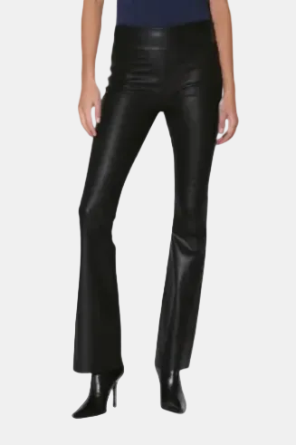 Black faux leather flare pants shown on a model from the waist down, paired with black pointed-toe stiletto heels against a light gray background.