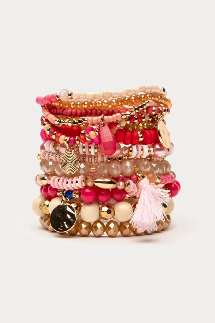 Stack of colorful beaded bracelets on a light background