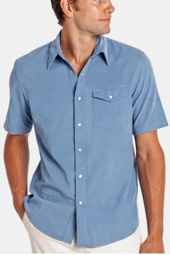 Man wearing a blue short-sleeve shirt on a white background