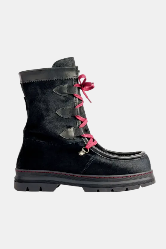 Black boot with pink laces on a white background