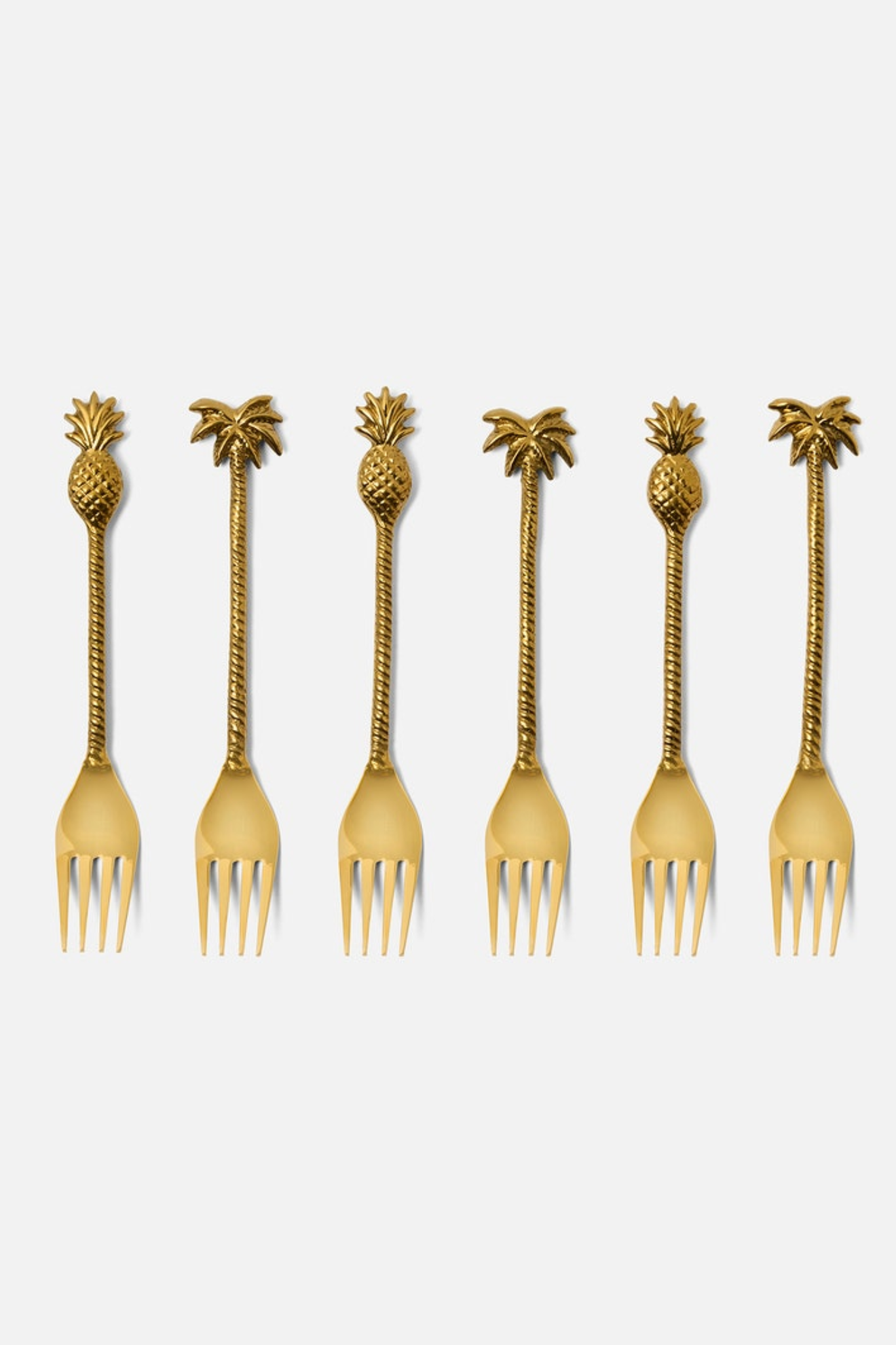 Set of six gold forks with pineapple ends on a white background