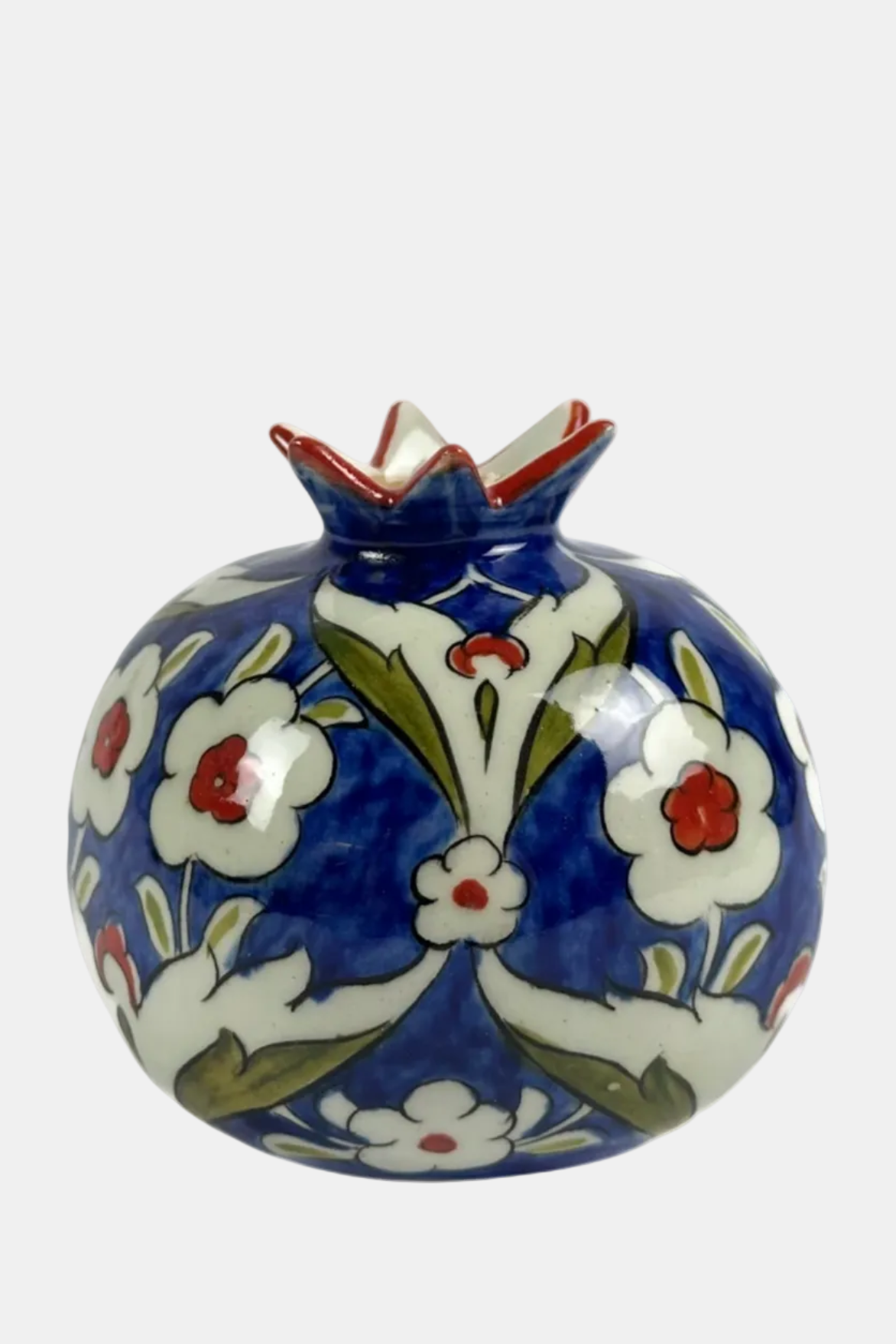 Decorative ceramic vase with floral patterns on a blue background.