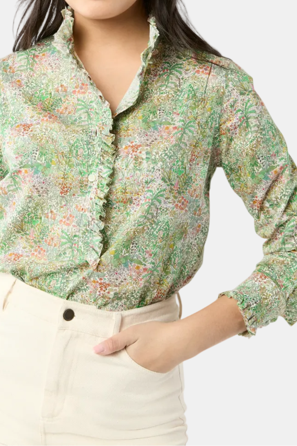 Woman wearing a floral blouse with a white background