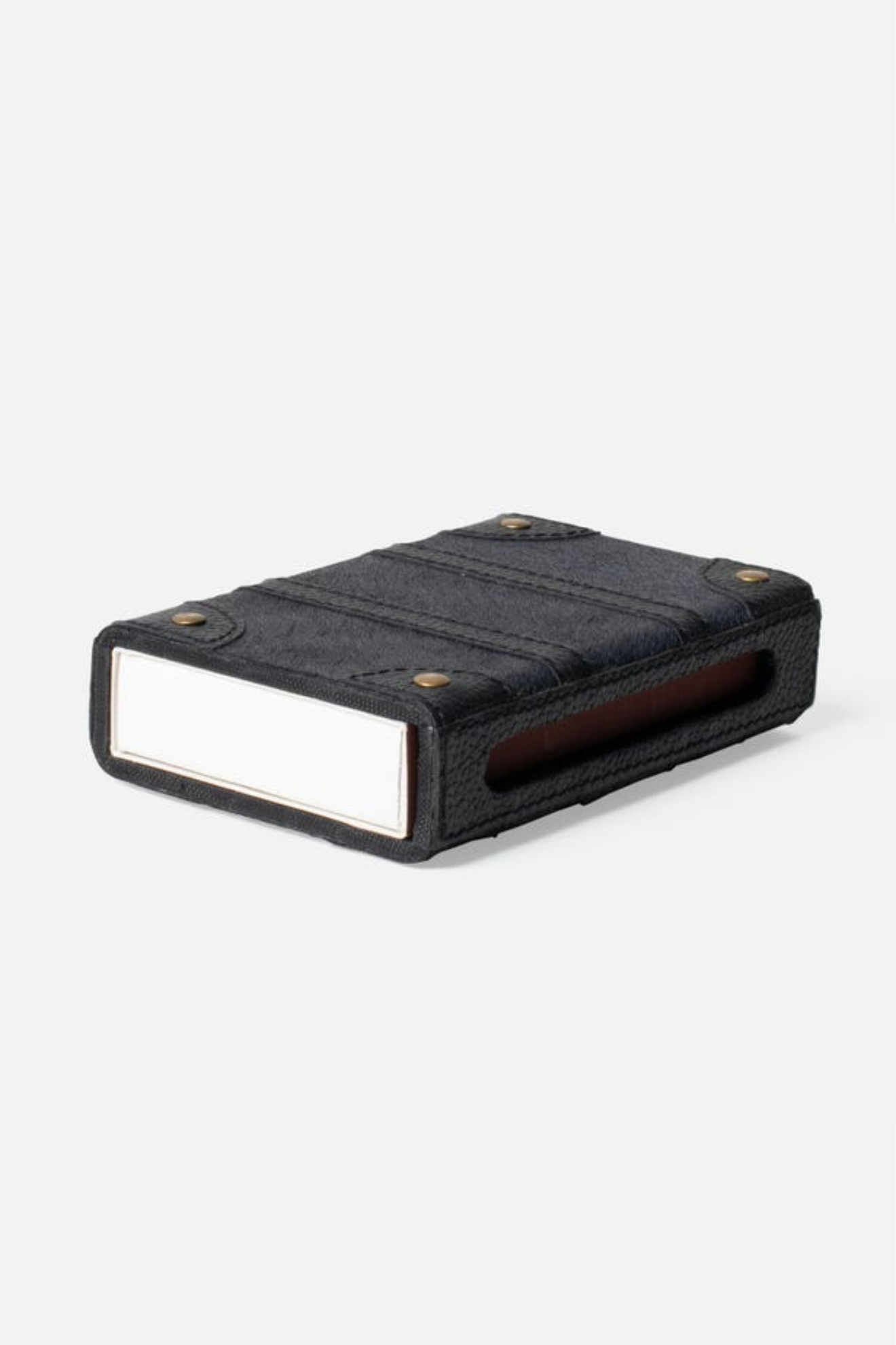 Black rectangular match box cover on a white background