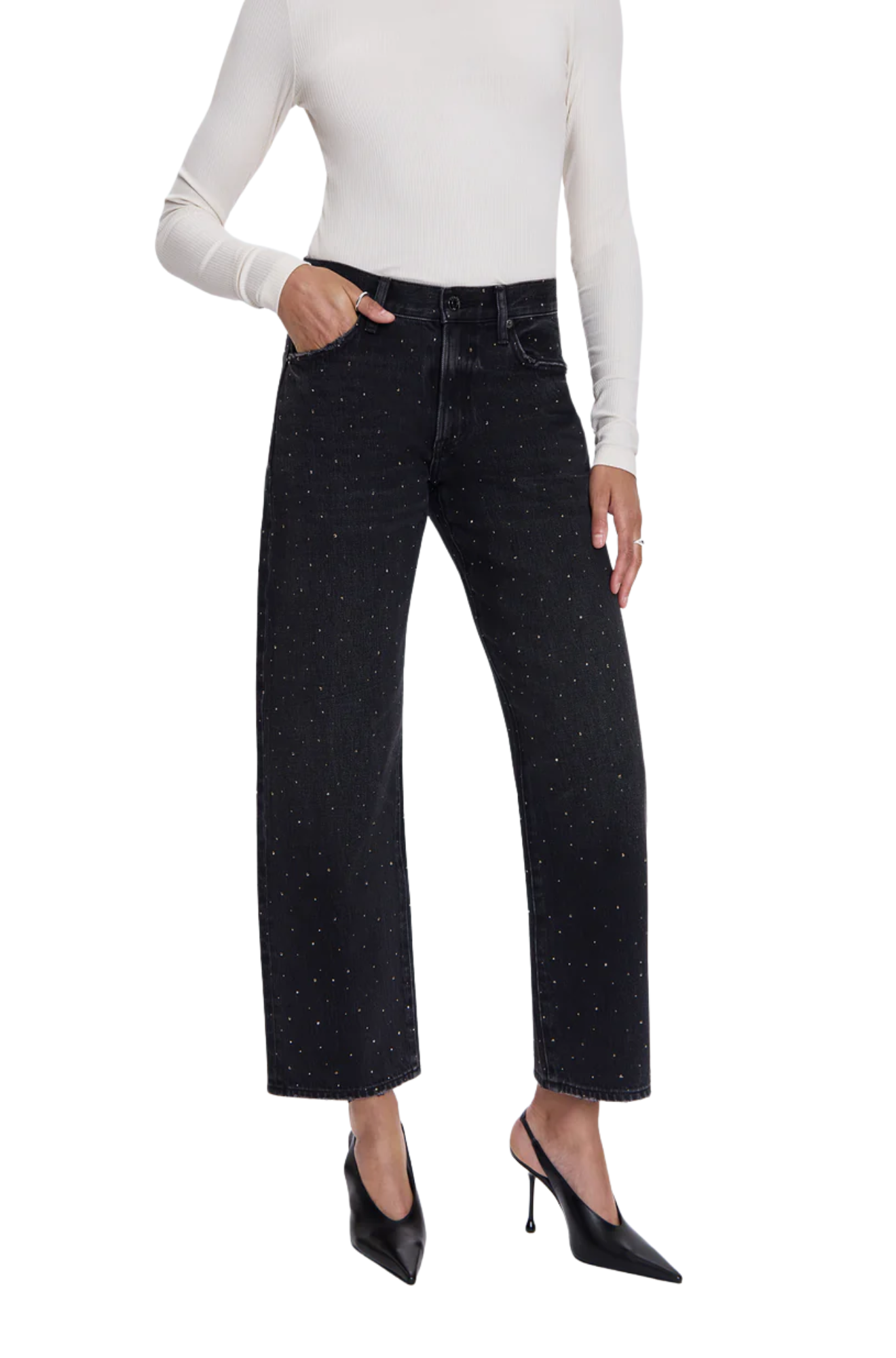 Person wearing black jeans and a white long-sleeve top on a white background