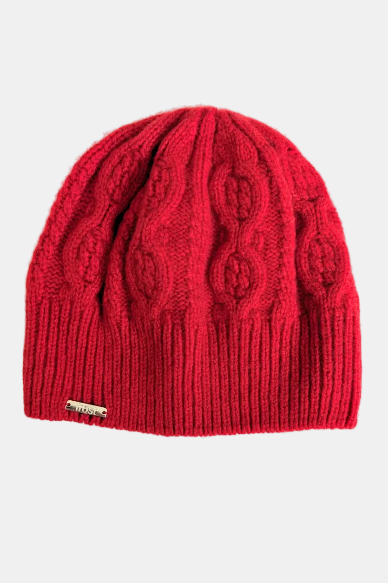 Red knitted beanie with cable pattern on a white background