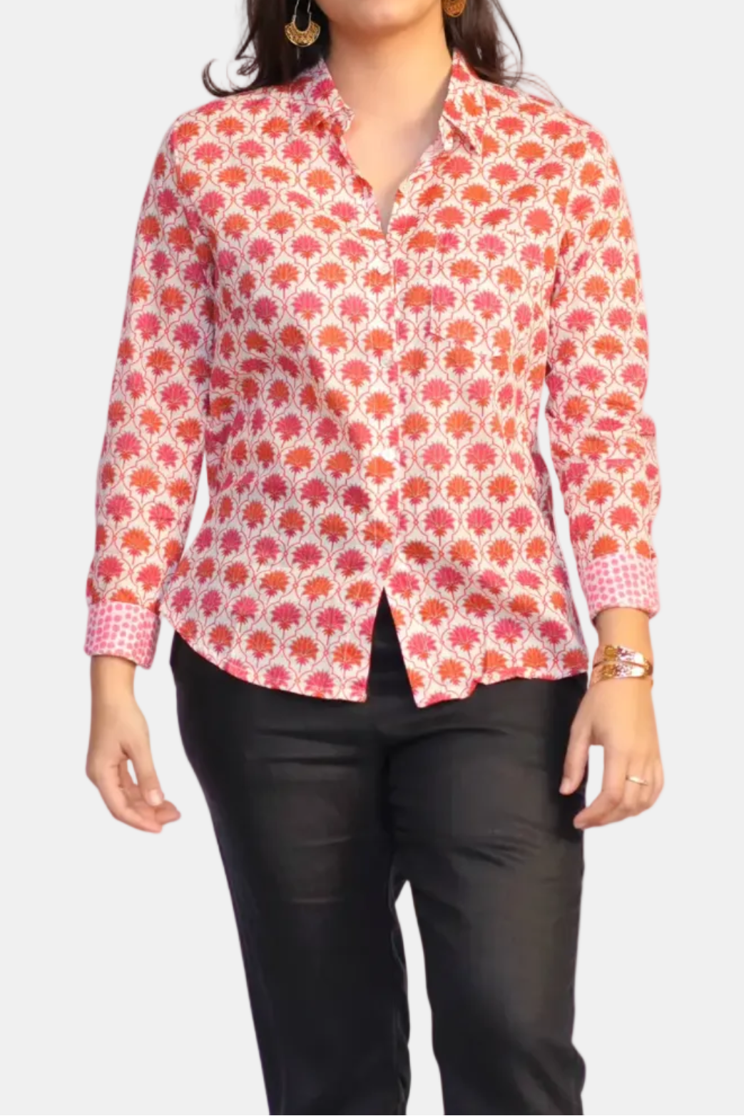 Woman wearing a patterned shirt on a white background
