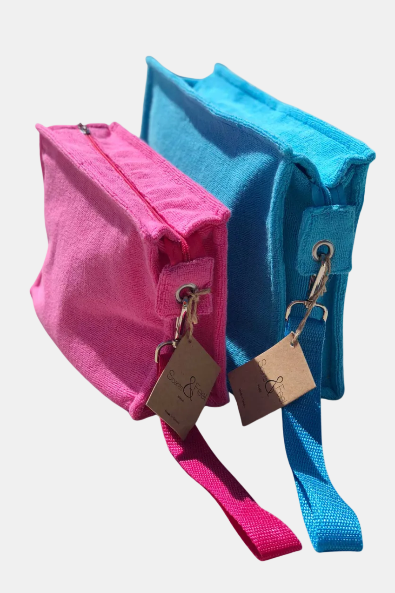 Pink and blue bags with tags on a white background