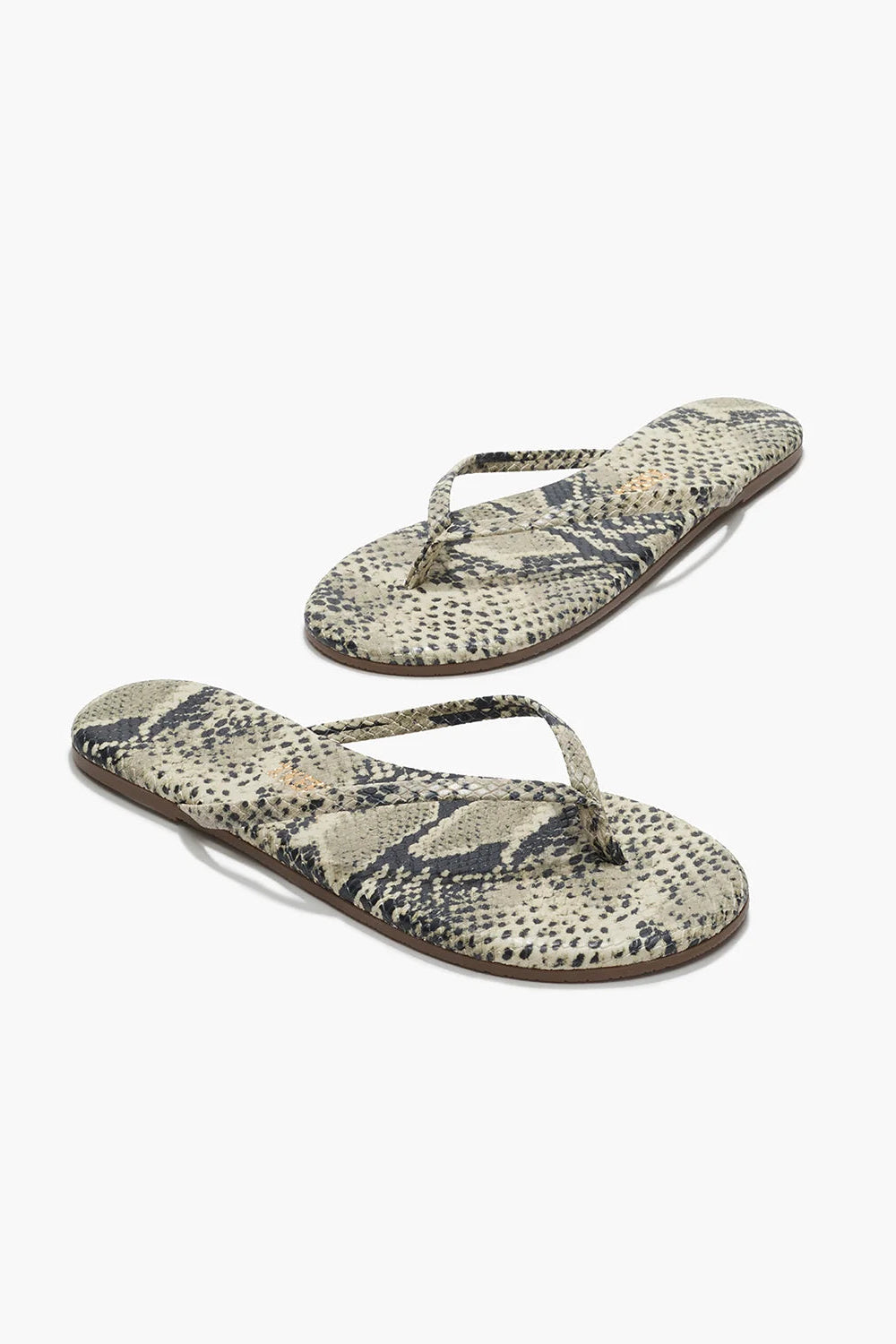 Pair of snake print flip-flops on a white background
