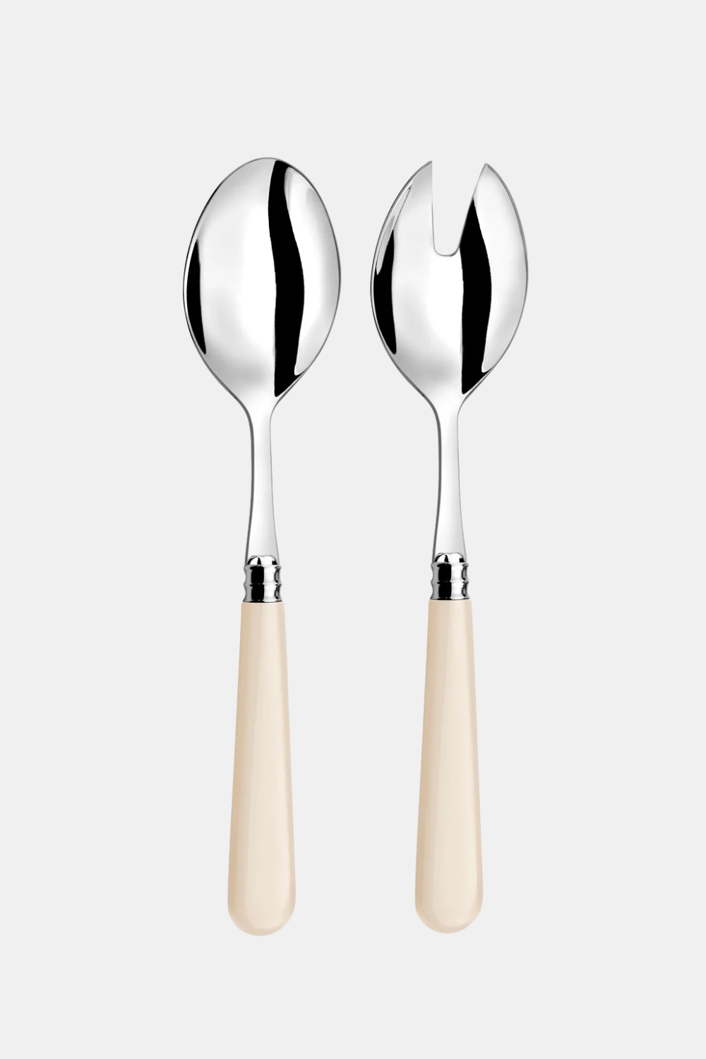 Two elegant serving utensils with polished silver metal heads and smooth cream-colored handles, displayed side-by-side on a light gray background.
