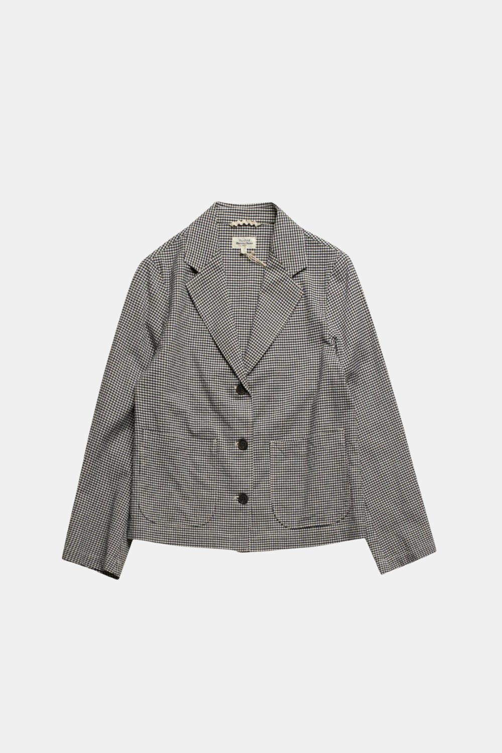 A gray and black micro-check patterned blazer with notch lapels, three front buttons, and two front patch pockets, shown flat on a light gray background.