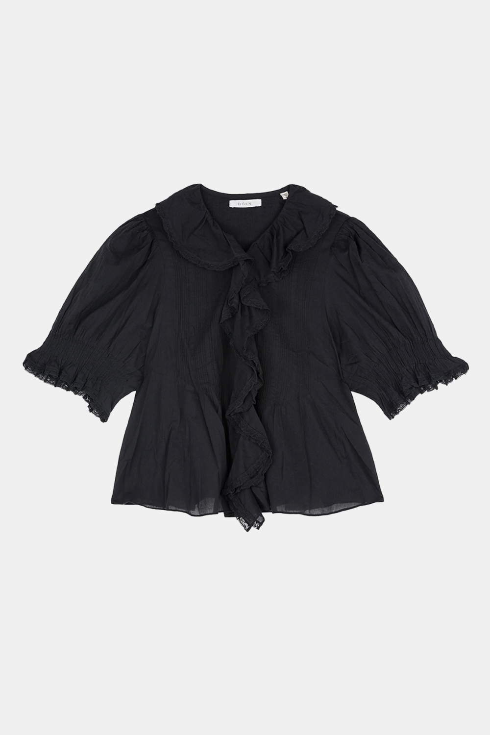 A black sheer blouse with a large ruffled collar, ruffled tie detail at the center front, and ruffled elbow-length sleeves, shown flat against a light gray background.