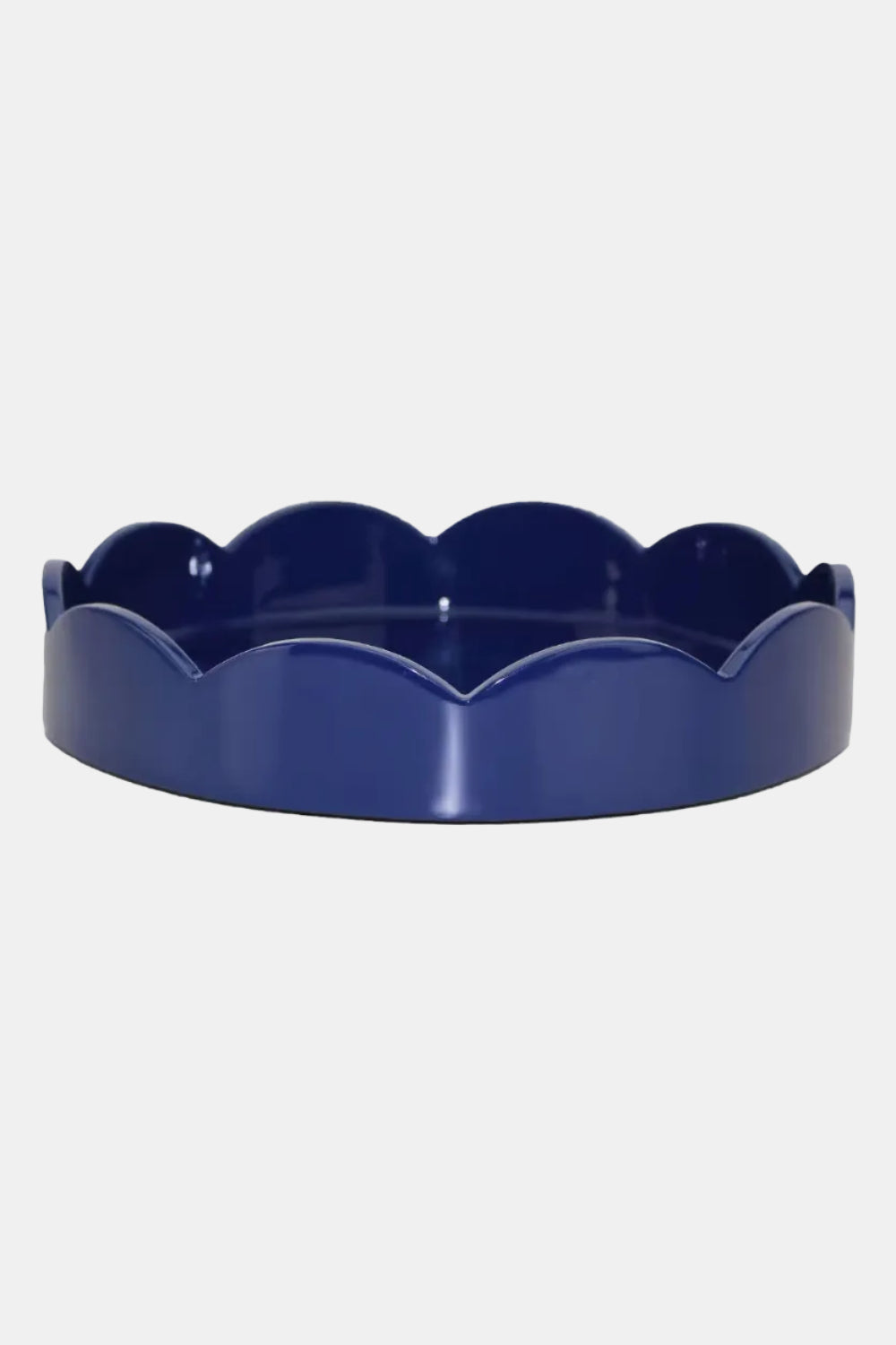 Blue scalloped-edge dish on a white background