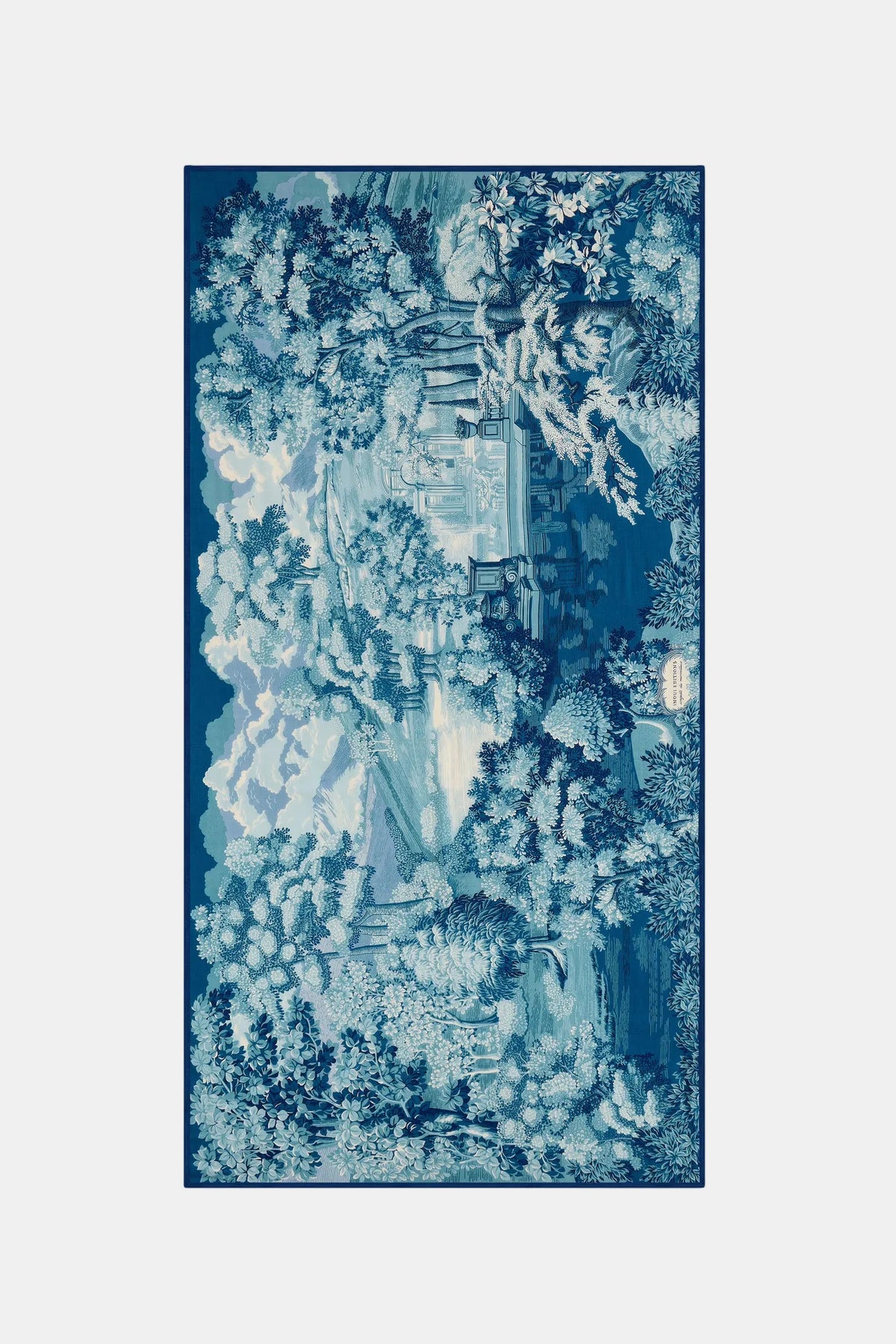 A rectangular area rug featuring a detailed blue and white toile-style landscape print with trees, water, and architectural elements, shown against a plain light gray background.