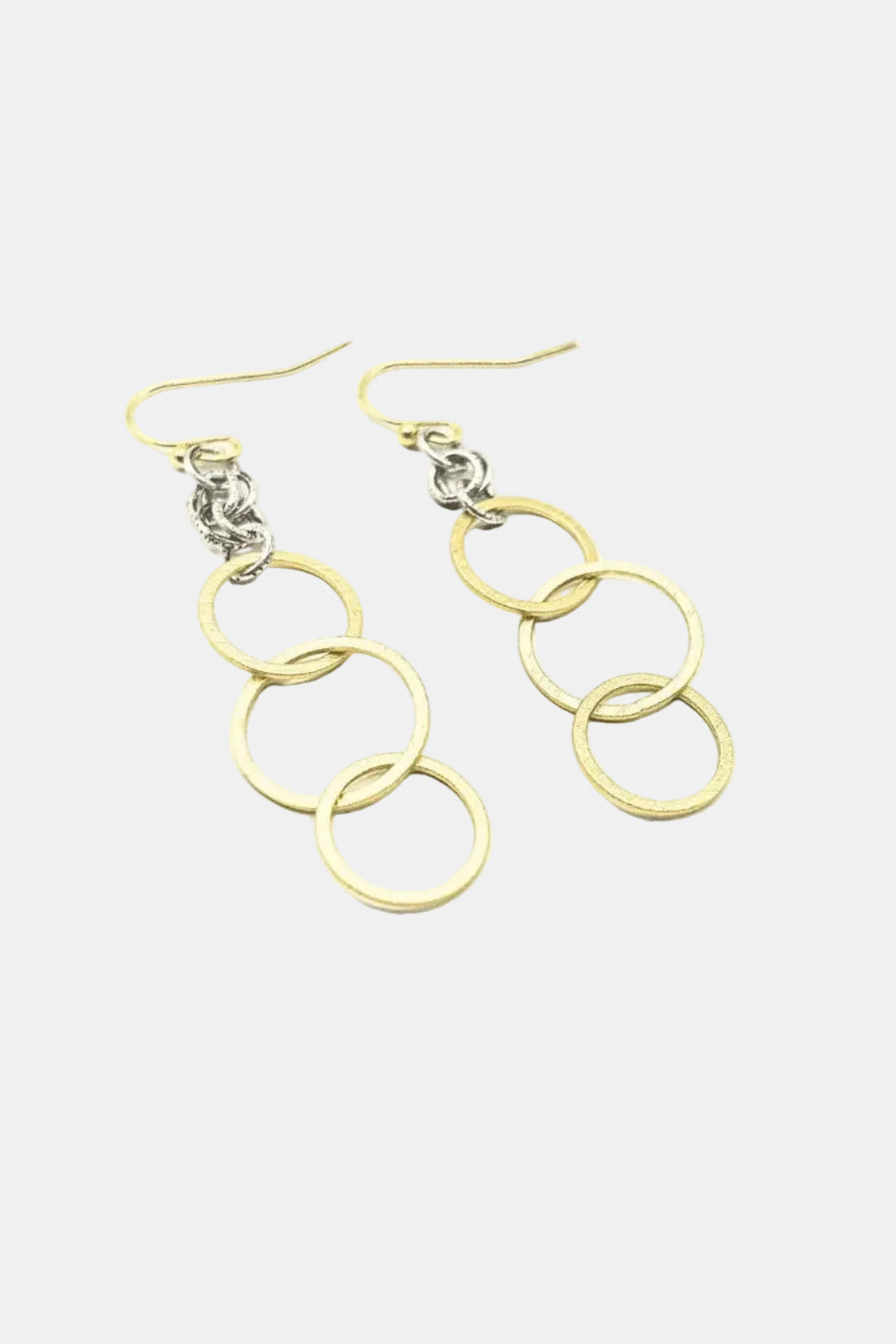 Gold chain earrings on a white background