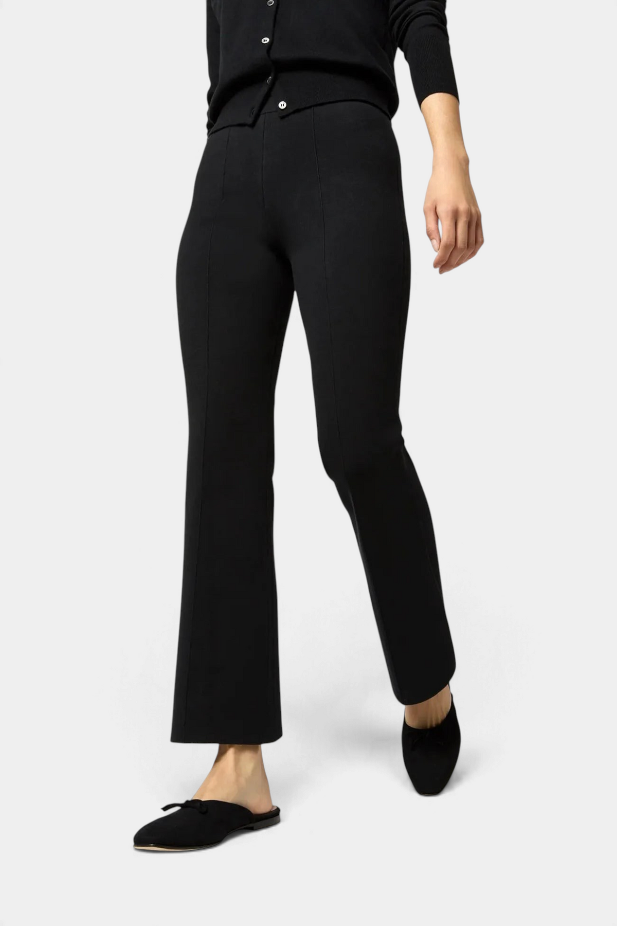 Ann Mashburn black Lara knit flare cropped pants with raised center seams and elastic waistband on a model
