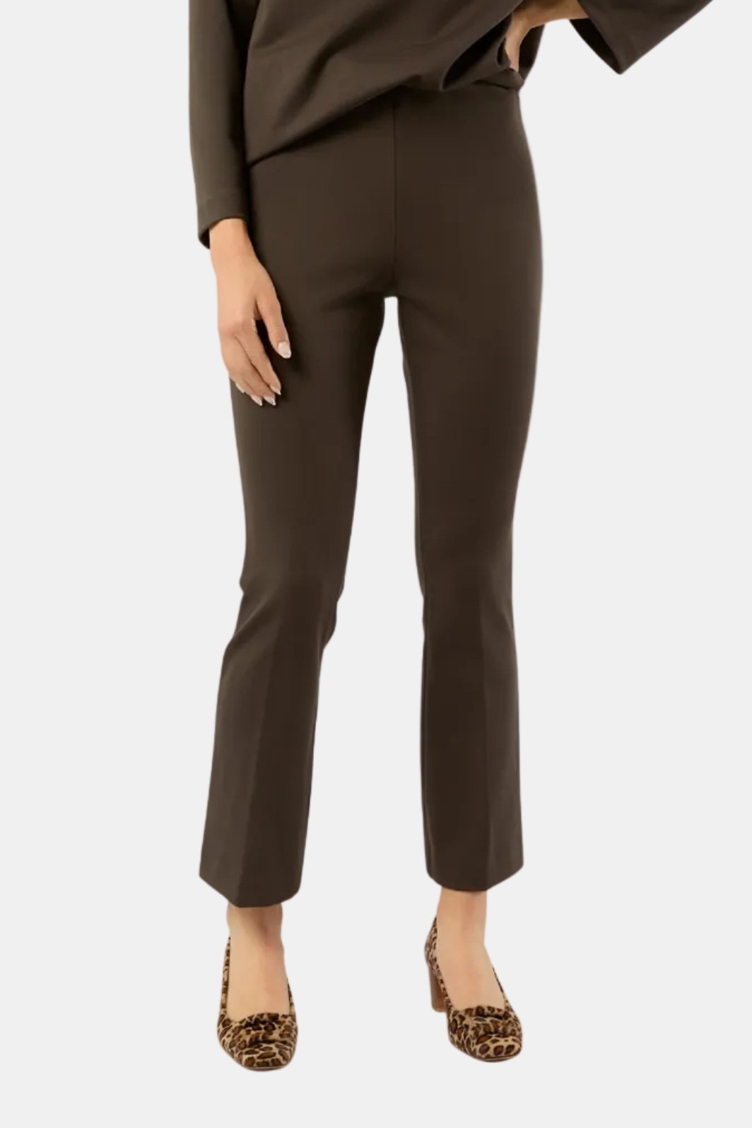 Brown outfit with a top and pants on a white background