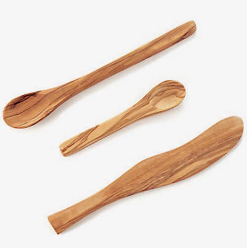Three wooden spoons on a white background