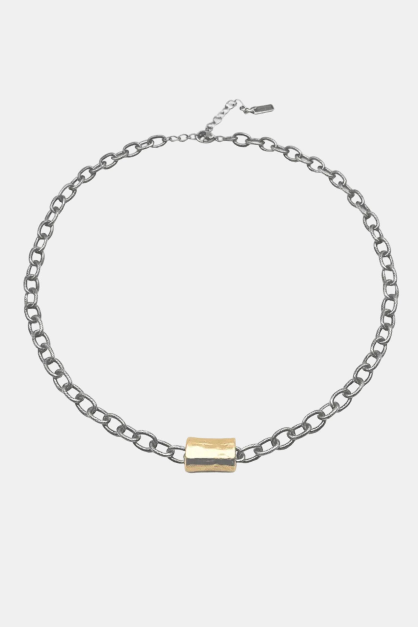 Silver chain bracelet with a gold clasp on a white background