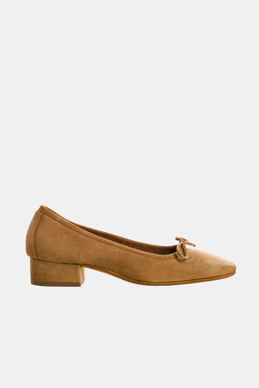 Tan suede shoe with a bow on a white background