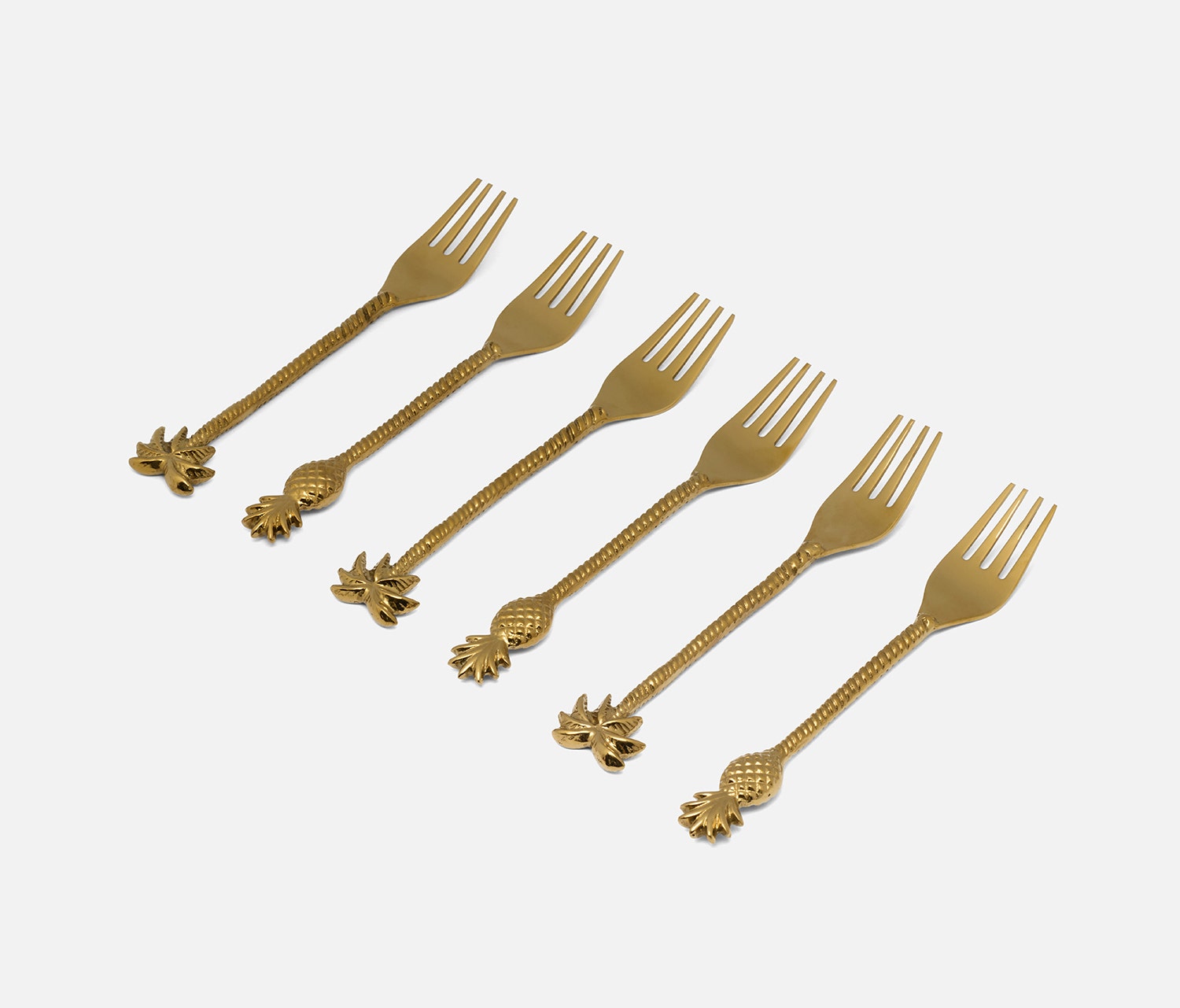 Six gold-colored metal forks arranged diagonally on a light gray background, each featuring a decorative pineapple-shaped handle.