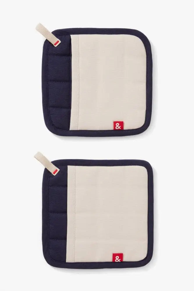 Two navy and beige pot holders with a brand logo on a white background