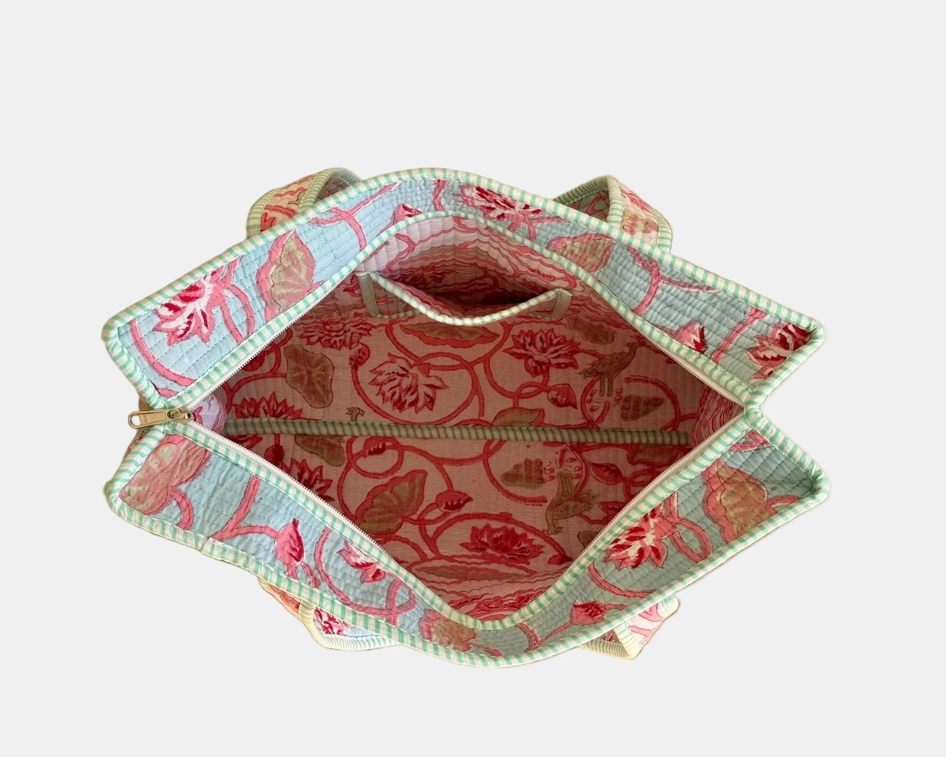 Floral-patterned fabric basket on a wooden surface