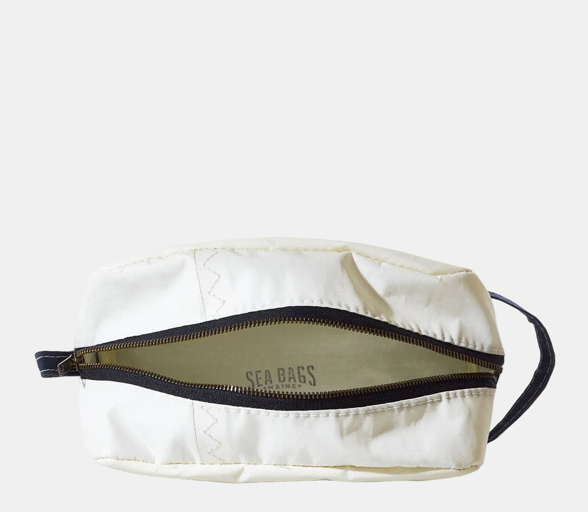 White toiletry bag with black zipper and 'Sea Bags' branding on a white background