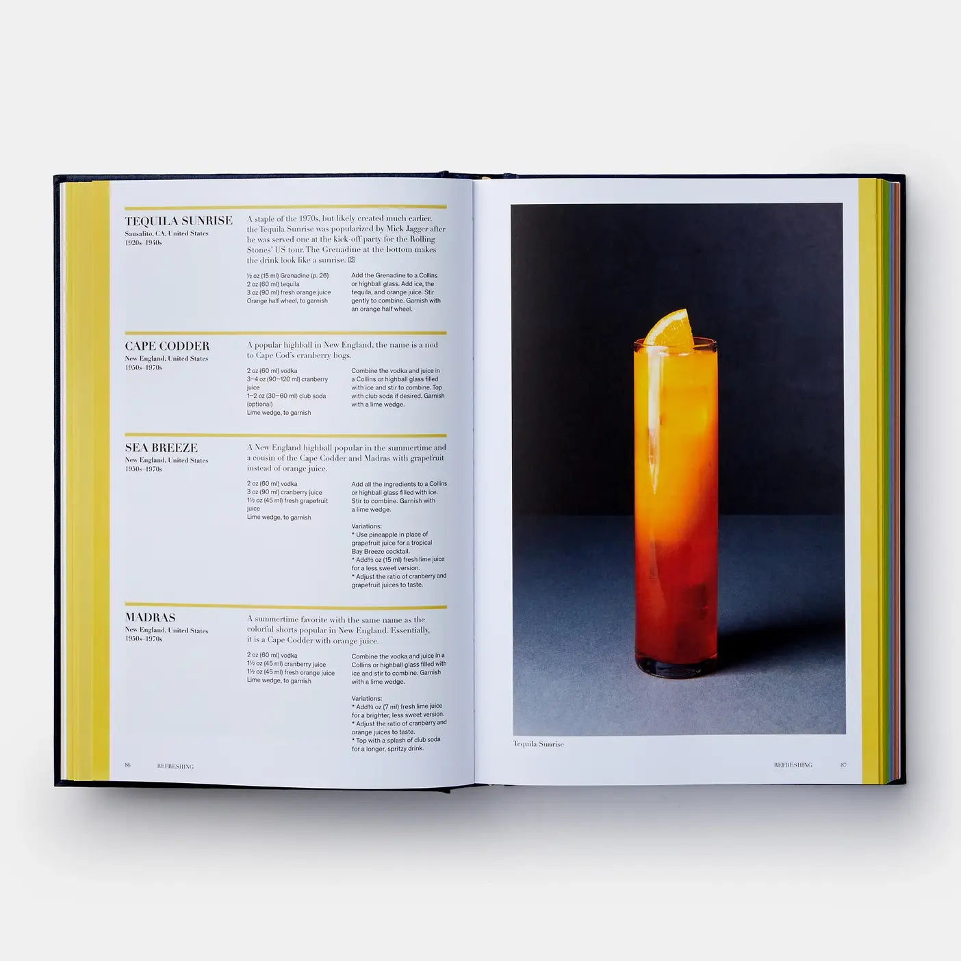 Open book showing a cocktail recipe with a tequila sunrise cocktail on a white background