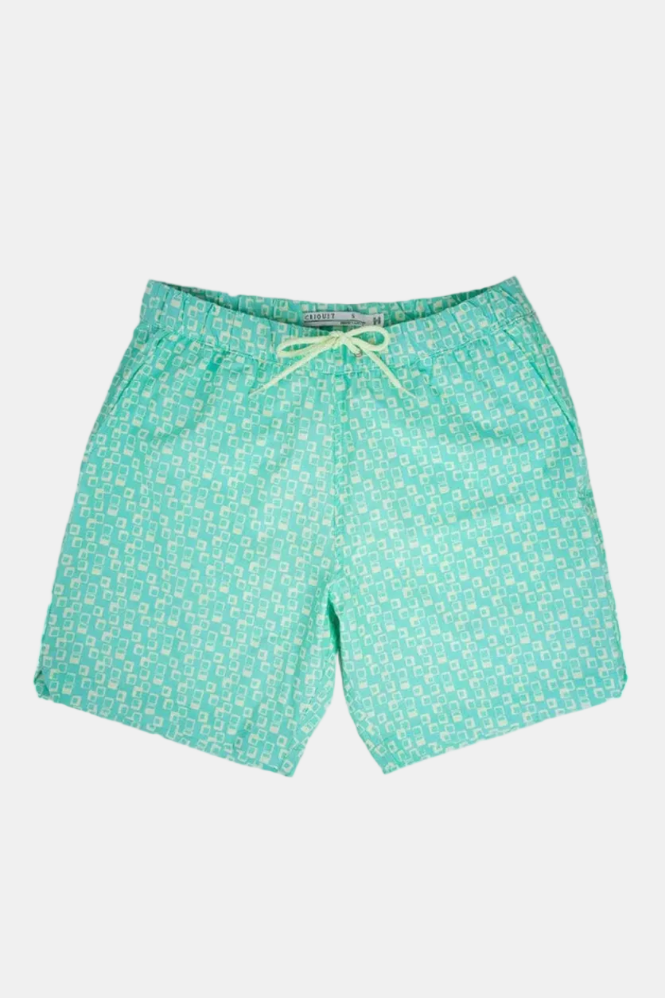 Green swim shorts with a pattern on a white background