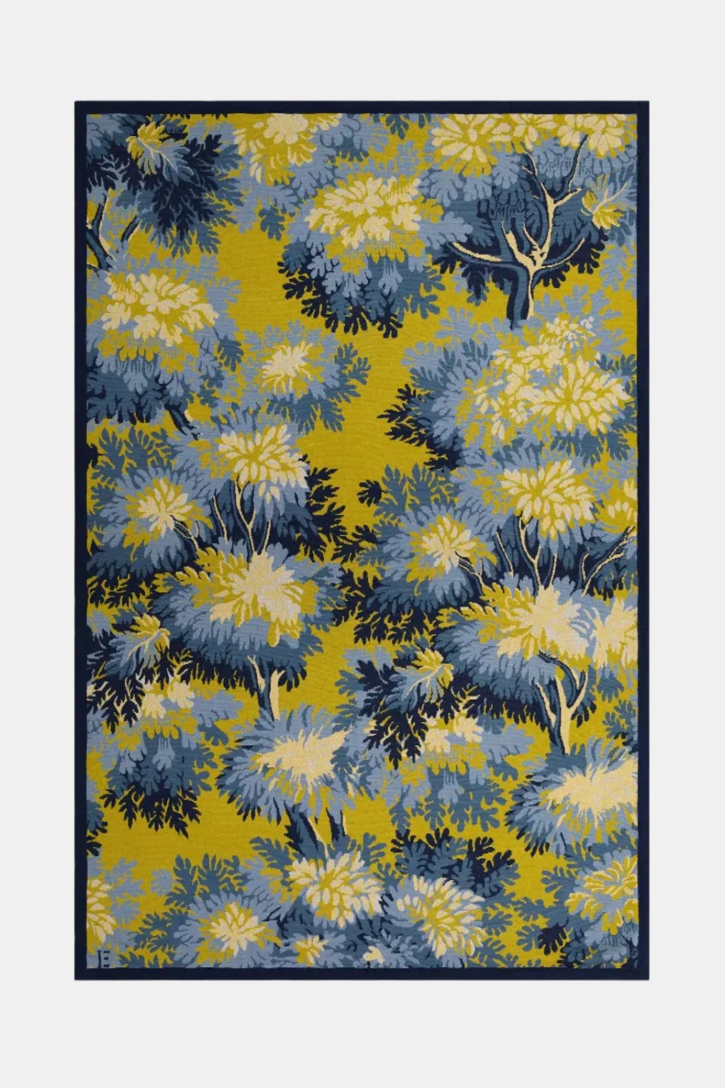 A rectangular area rug with a botanical pattern featuring blue and yellow flowers on a mustard yellow background, framed by a thin dark border, shown against a light gray background.
