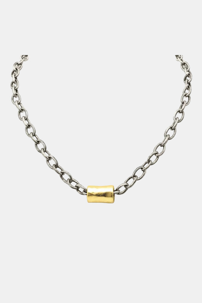 Gold and silver chain necklace on a white background
