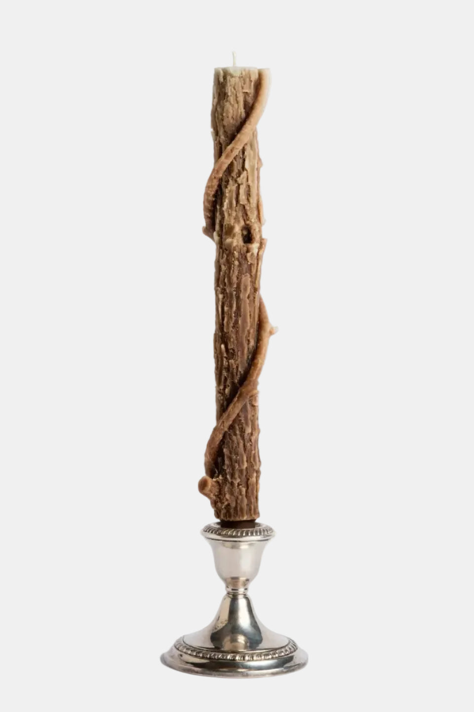Candle with twisted wooden holder on a white background