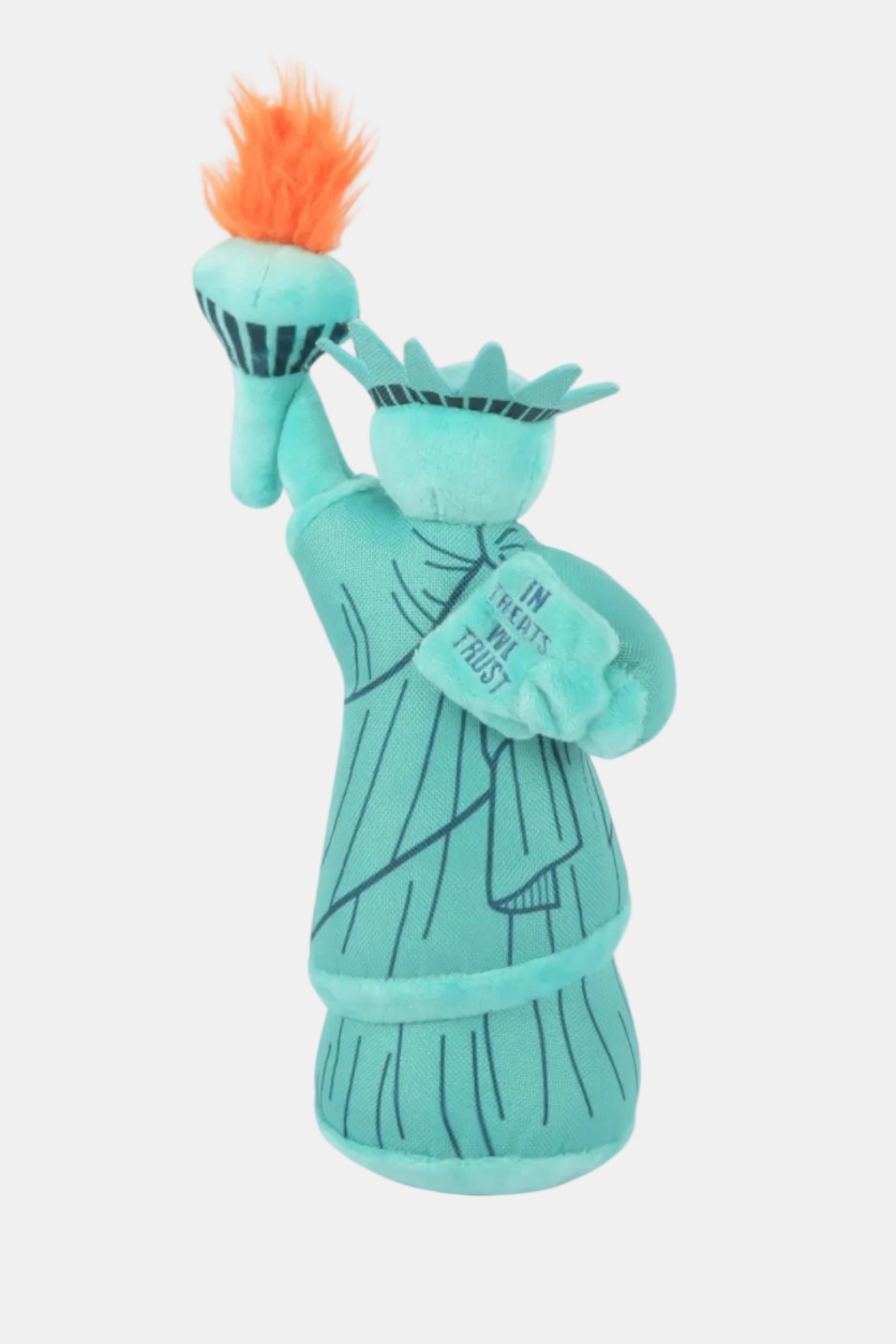 Toy resembling the Statue of Liberty on a white background