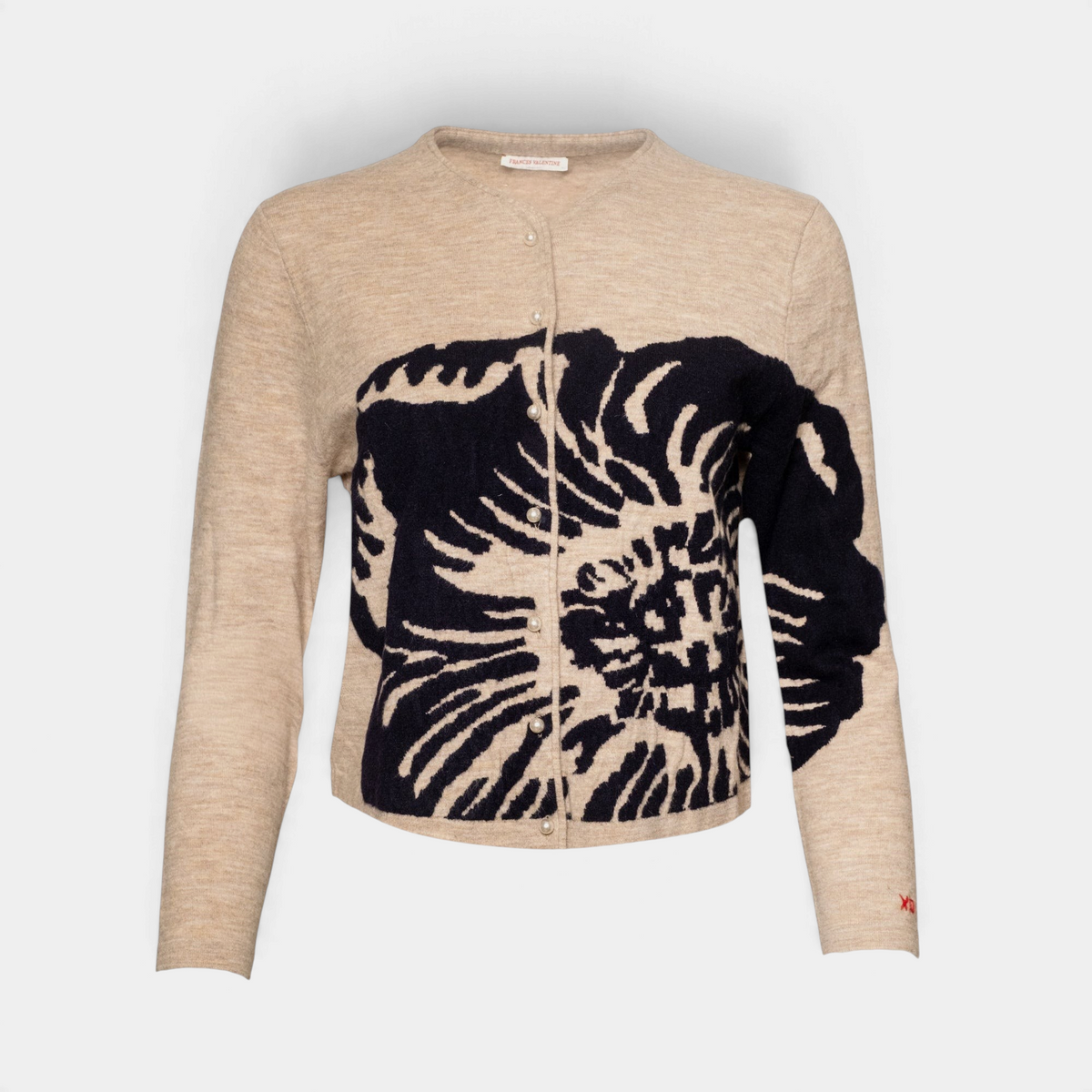 Frances Valentine Darling cardigan in beige merino wool with a large black floral print and elegant pearl buttons.