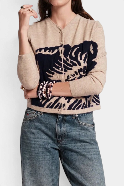 Frances Valentine Darling cardigan in beige merino wool with a navy floral print, pearl buttons, and bracelet sleeves.