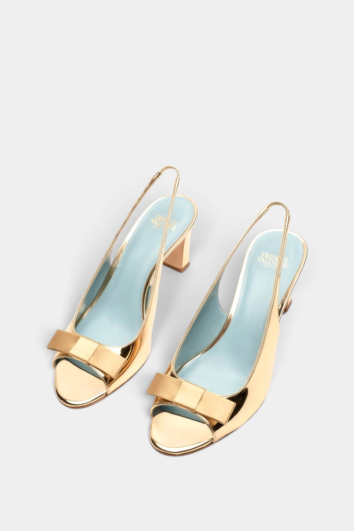 Frances Valentine Reese mirror gold slingback heels with satin bow detail, open-toe design, and light blue insoles.