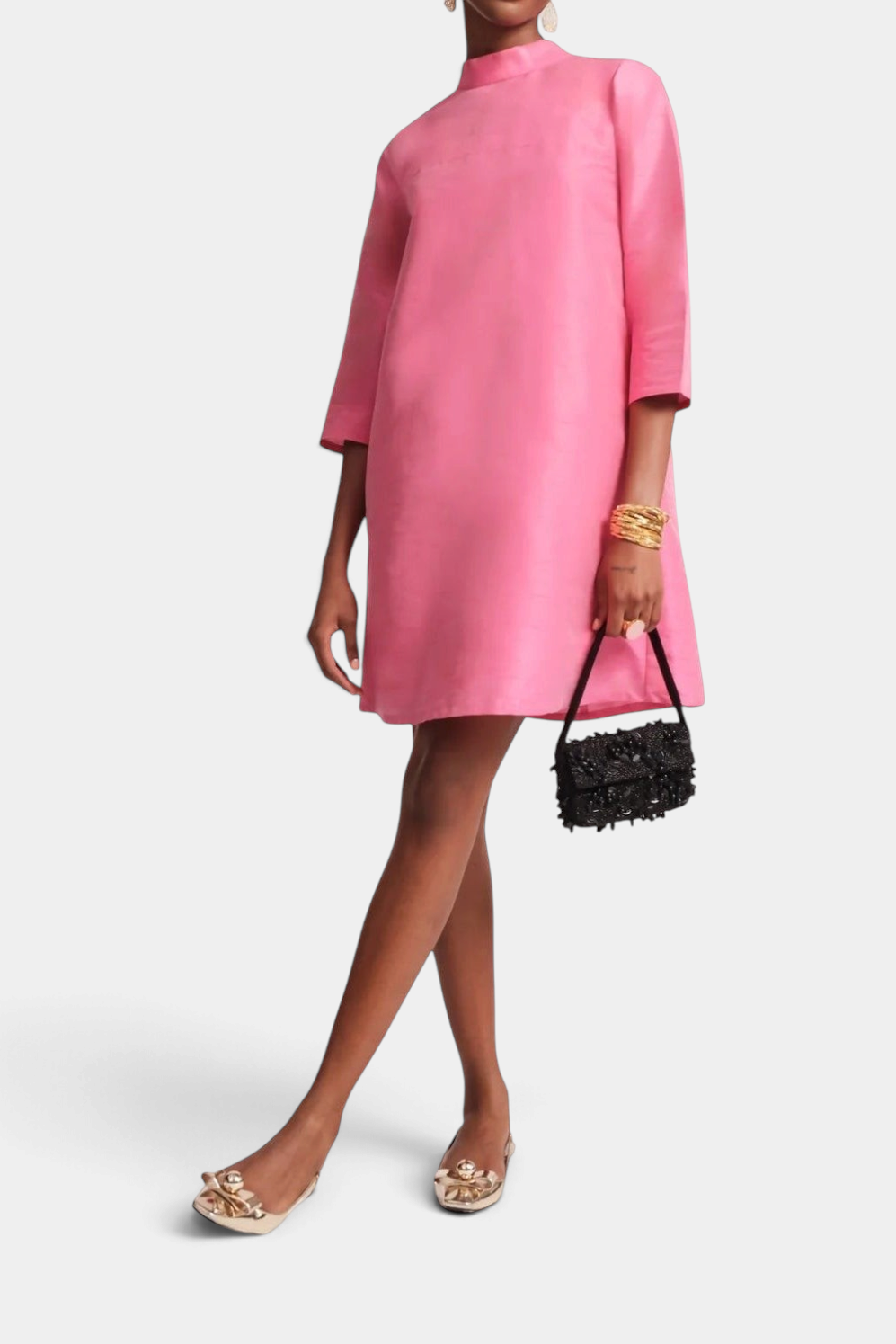 Frances Valentine vibrant pink silk A-line dress with high neckline, three-quarter sleeves, and back bow detail.