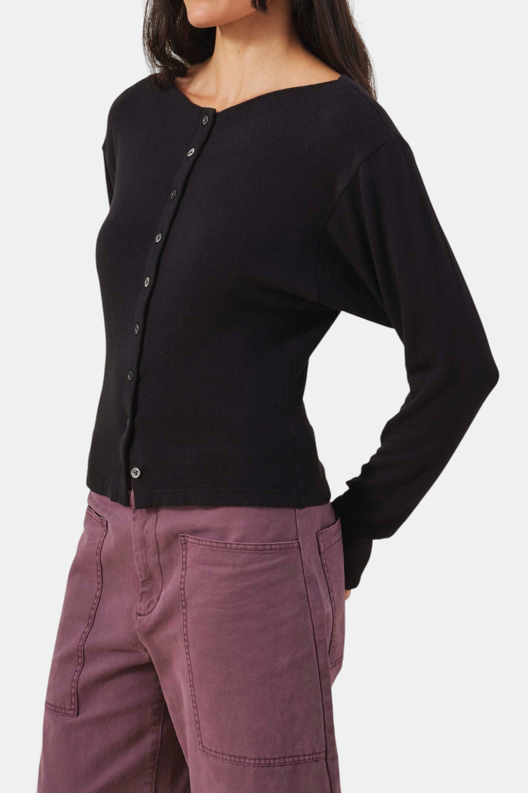 The Copper Shed Jordan black fine-gauge knit cardigan with round neck, button front, and long sleeves with thumbholes.