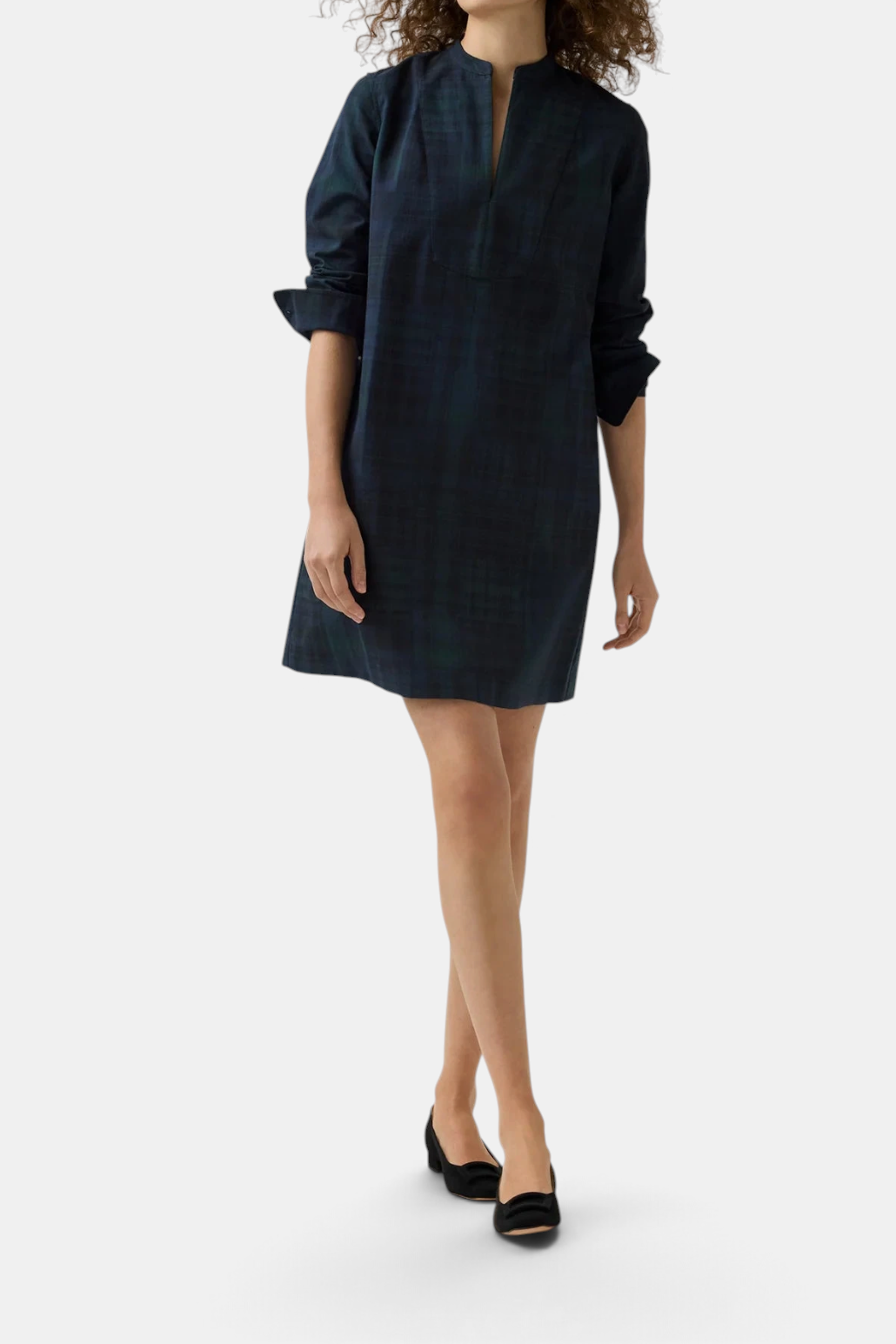 The Copper Shed Mackey tartan cotton dress with mandarin collar and tuxedo bib detail in a dark green plaid pattern.
