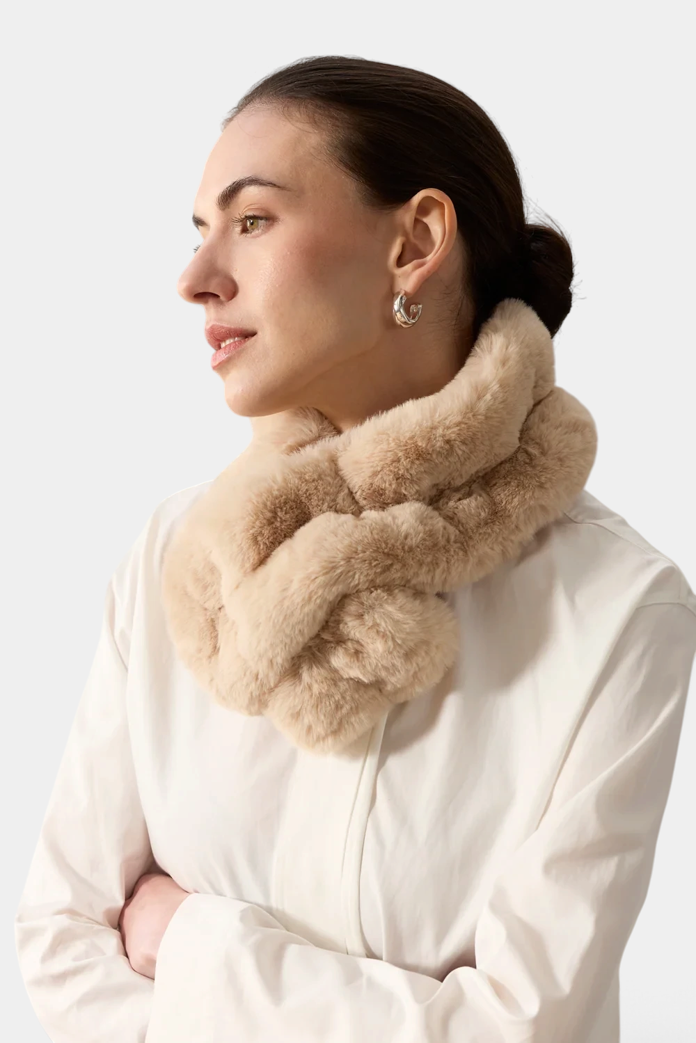 The Copper Shed beige faux fur ruffle scarf with stretch-gathered texture and elasticated loop worn by a woman.