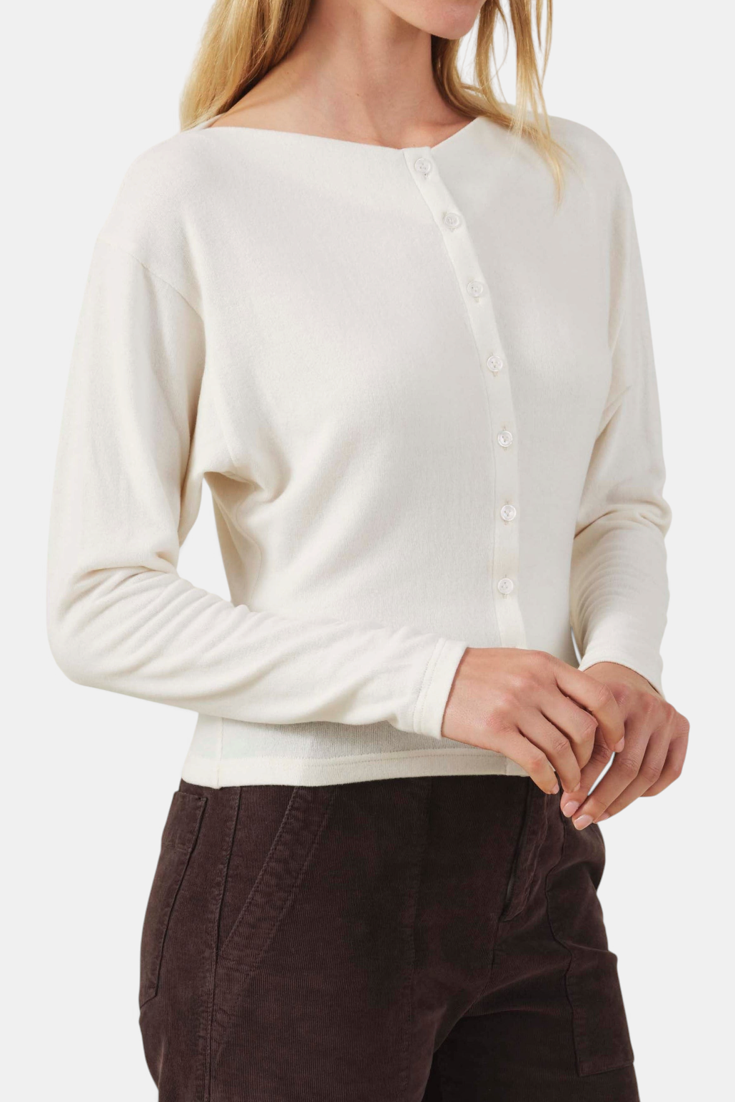 The Copper Shed Jordan cream fine-gauge knit cardigan with round neck, button front, and thumbhole sleeve details.