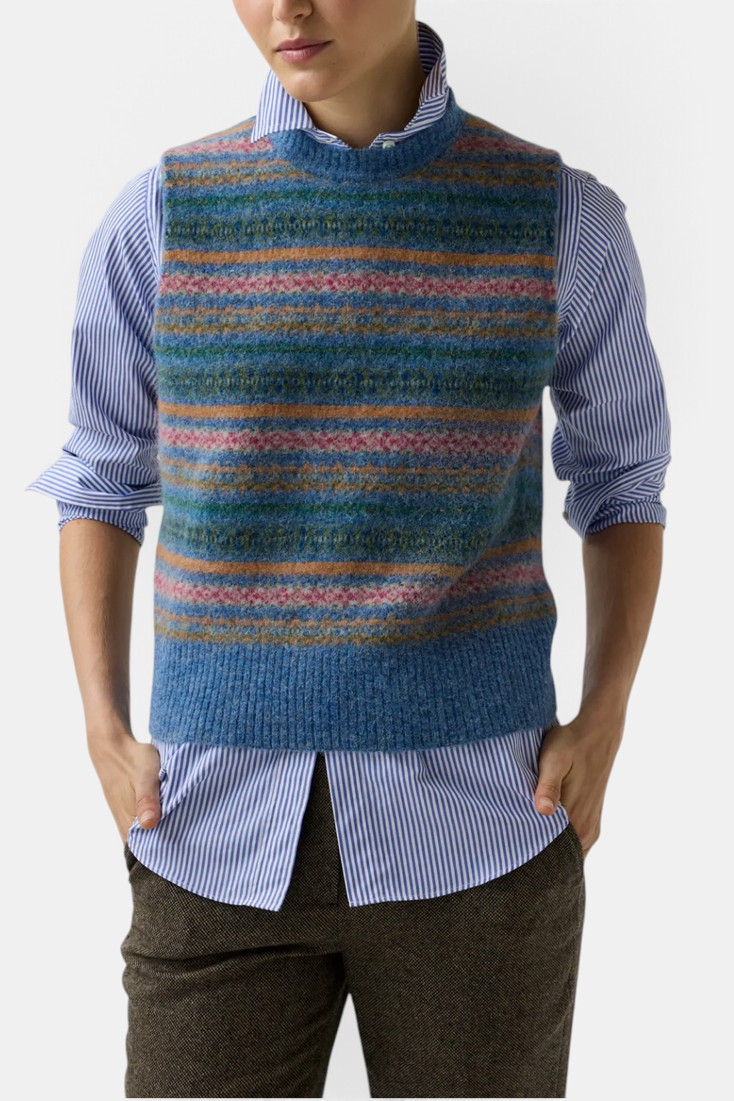 The Copper Shed Silvia Fair Isle sweater vest in blue brushed alpaca wool blend with a striped pattern.