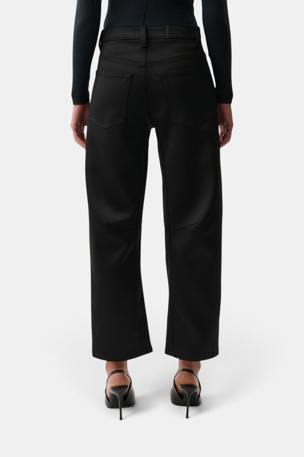The Copper Shed black sateen cropped pants with seamed crescent leg detail, back view.