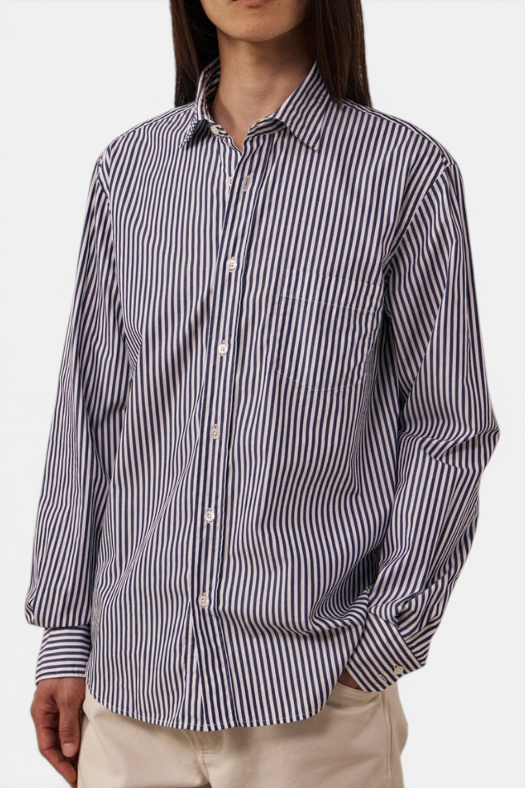 The Copper Shed Paul poplin shirt in navy and white vertical stripes with a semi-spread collar and chest pocket.