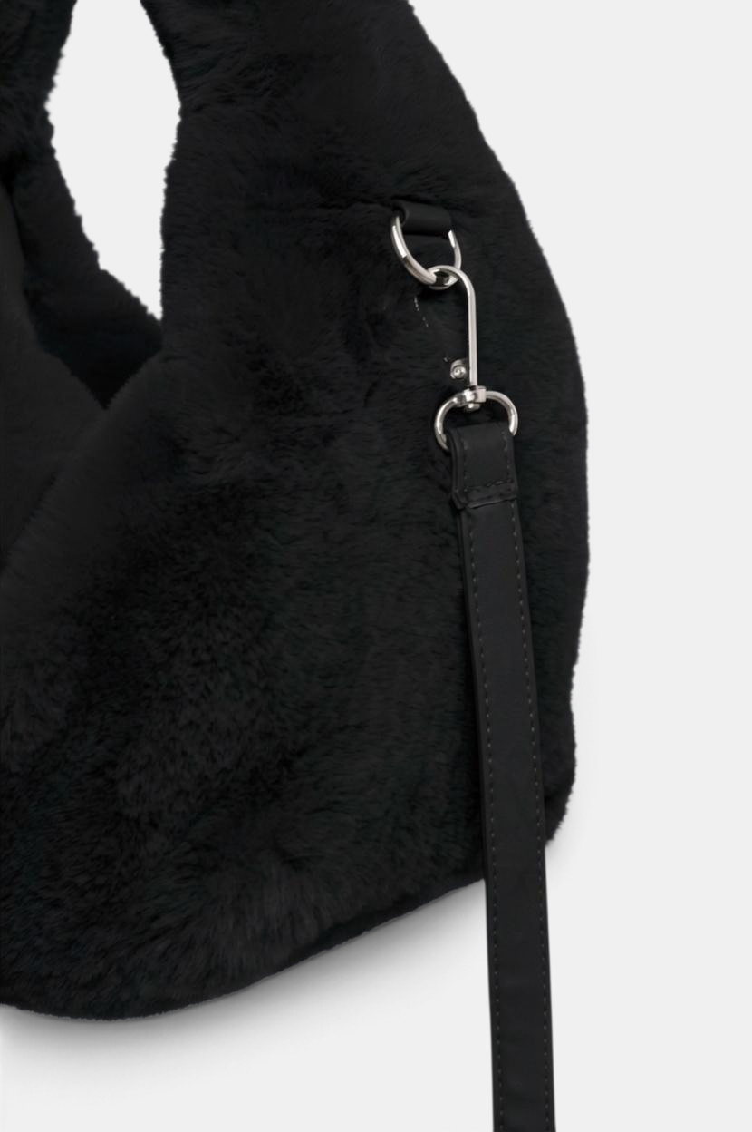 The Copper Shed black faux fur crossbody bag with a removable shoulder strap and silver hardware detail.