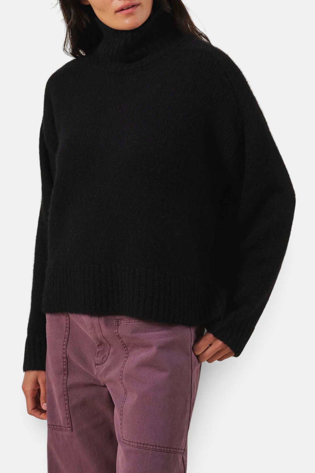 The Copper Shed Kendall08 black cashmere blend turtleneck sweater with ribbed trim in a relaxed fit.