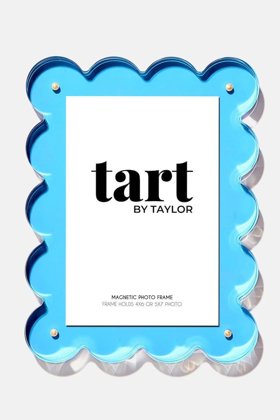 Blue scalloped photo frame with 'tart by Taylor' branding on a white background