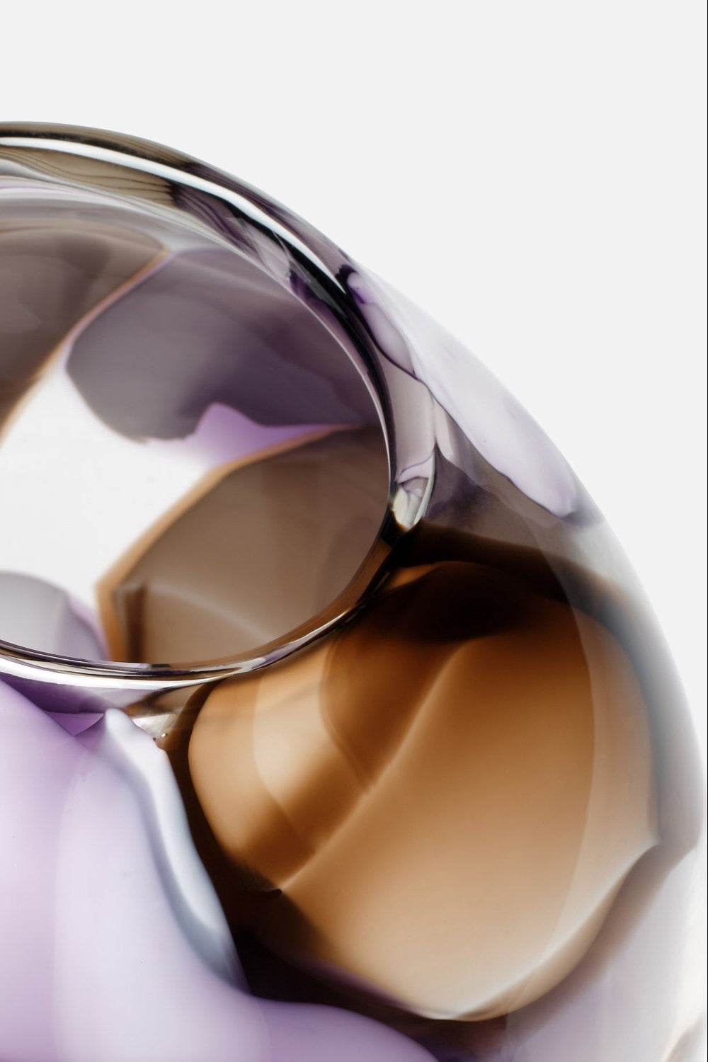 Close-up of a metallic bracelet with a reflective surface on a white background