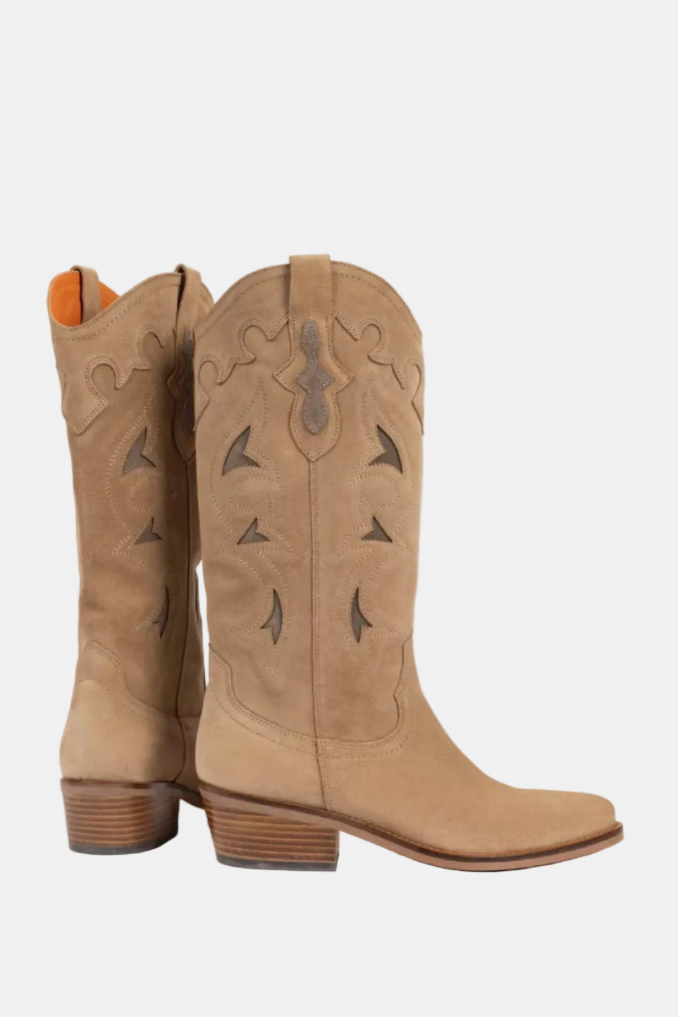 Pair of tan cowboy boots with decorative patterns on a white background